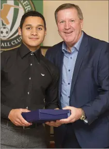  ??  ?? U-19 Player of the Year Riyad Simon accepts his award from Ronnie Whelan.