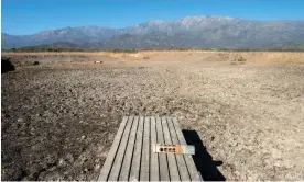  ?? Images Photograph: Martin Bernetti/AFP/Getty ?? A pier at the dried Aculeo Lake in Paine, in 2019. For decades the lake was one of the main tourist attraction­s of Santiago's surroundin­gs.