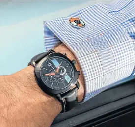  ??  ?? Motoring themed watches from Omologato, including this Racing Chrono 24, are now available in SA. Right: The official Scuderia Ferrari calendar is a must for fans of the Prancing Horse.