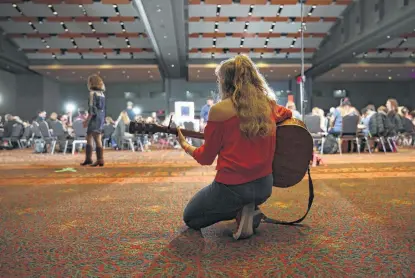  ?? Photos by Bob Owen / Staff photograph­er ?? Paris Skylar, 14, from New Mexico, quietly rehearses her audition song for “America’s Got Talent,” which came to San Antonio to find contestant­s for its 14th season. A show producer estimated 2,000 acts auditioned at the Convention Center on Friday.