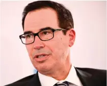  ?? AFP PHOTO ?? BIDDING
Former US secretary of the Treasury Steven Mnuchin speaks during the Milken Institute Global Conference on Oct. 19, 2021. Mnuchin on Thursday, March 14, 2024, said he was putting together a team of investors to buy TikTok from its Chinese owners.