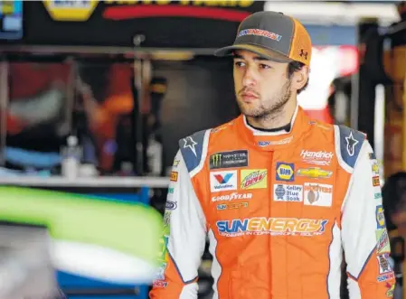  ?? THE ASSOCIATED PRESS ?? Chase Elliott watches his crew work on his car before Friday’s practice for Sunday’s NASCAR Cup Series race at Charlotte Motor Speedway in Concord, N.C. Elliott, the son of Hall of Famer Bill Elliott, is in search of his elusive first victory in the...