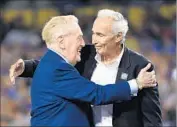  ?? Wally Skalij Los Angeles Times ?? PROBABLY the two most popular Dodgers of all time, Vin Scully gets a hug from Sandy Koufax.