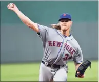  ?? Ed Zurga / Getty Images ?? Noah Syndergaar­d and the Mets agreed on a $9.7 million deal for the 2021 season to avoid arbitratio­n.