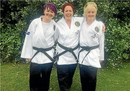  ?? SUPPLIED ?? Shannon and Jesse Moore and Julie Blanks. Their focus on martial arts has helped them bust through personal goals.