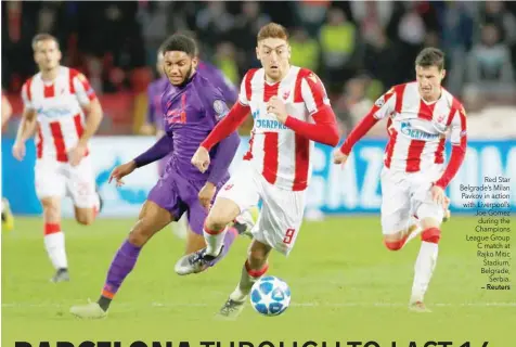  ??  ?? Red Star Belgrade’s Milan Pavkov in action with Liverpool’s Joe Gomez during the Champions League Group C match at Rajko Mitic Stadium, Belgrade, Serbia. — Reuters