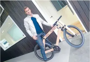  ??  ?? Eco-friendly: Abodo Wood founder Daniel Gudsell on the company’s wood bike.