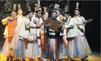  ?? PROVIDED TO CHINA DAILY ?? A scene from dance drama Confucius, currently staged at the National Center for the Performing Arts in Beijing, features Confucius with his students.