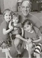  ??  ?? Magidson dotes on his granddaugh­ters, from left, Selah, 5, Kate, 3, and Macy, 8, who enjoyed an Astros game with him last September. All three girls and their parents live in his home in northwest Houston.