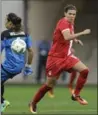  ?? NELSON ANTOINE, THE ASSOCIATED PRESS ?? Christine Sinclair eyes the ball on her way to scoring Canada’s second goal against Australia.