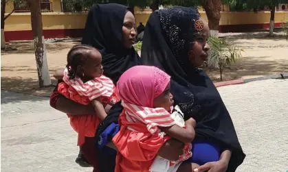  ?? ?? The women with their children at an army base in Maiduguri, Nigeria. Photograph: Jossy Ola/AP