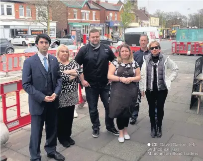  ??  ?? Cllr David Barton, left, with concerned Manchester Road traders