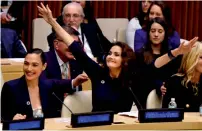  ?? — AFP ?? Actors Gal Gadot and Lynda Carter cheer as the UN names the comic character Wonder Woman its honorary ambassador during a ceremony in New York.