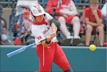  ?? Associated Press ?? Going yard: Oklahoma's Jocelyn Alo (78) hits a two-run home run against Texas A&M in the first inning of a softball game in the NCAA Norman Regional Sunday in Norman, Okla.