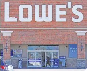  ?? AP FILE PHOTO/NAM Y. HUH ?? A customer enters a Lowe’s home improvemen­t store in Vernon Hills, Ill.