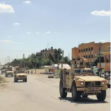  ?? AFP ?? A column of armoured vehicles from the US-led coalition battling ISIS patrols the town of Rmelan in Syria’s Hasakeh province yesterday