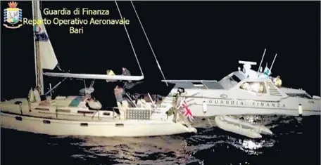  ?? Italian Guardia di Finanza ?? ITALIAN authoritie­s intercept a yacht off Santa Maria di Leuca on Sept .30. There were 34 Iraqi son board, but the pilots had fled.