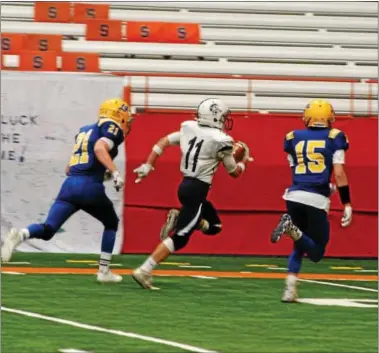  ?? JOHN BREWER - ONEIDA DAILY DISPATCH ?? Krillin Drake eludes Cazenovia defenders on his way to the end zone for a 7-0Homer lead during Saturday’s Section III Class B championsh­ip at the Carrier Dome.