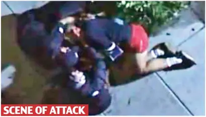  ??  ?? SCENE OF ATTACK
Frantic: TV footage of paramedics as they treat Ryan Fischer after the street shooting