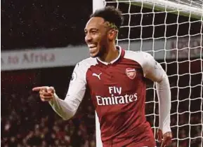  ??  ?? Arsenal’s Pierre-Emerick Aubameyang celebrates after scoring against Everton on Saturday.