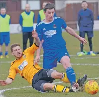  ?? Photos: Iain Ferguson, the Write Image. ?? The Fort’s Michael Gillespie puts in a strong tackle on Cove’s Grant Campbell.