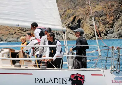  ?? PHOTO : DEAN BARNES ?? Stan Joines, in 2013, races with a young crew recruited from
St. Croix Central High School. The former music teacher has been instrument­al in getting young islanders on the water.