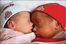  ??  ?? Twins Amelia and Bennett Schooley are seen at home together for the first time on the day Bennett was released from the NICU.