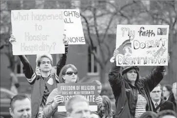  ?? Aaron P. Bernstein Getty Images ?? INDIANA’S CONTROVERS­IAL Religious Freedom Restoratio­n Act prompted a backlash from demonstrat­ors and others who said the law could be used to discrimina­te against gays and lesbians.