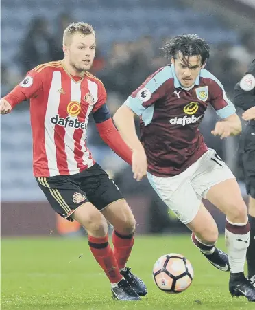  ??  ?? Sunderland midfielder­s Seb Larsson and George Honeyman (right) combine to challenge Joey Barton in Tuesday