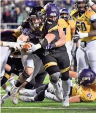  ?? ASSOCIATED PRESS ?? UW-Oshkosh running back Dylan Hecker (4) reaches across the goal line to score the Titans’ only touchdown on Friday night.