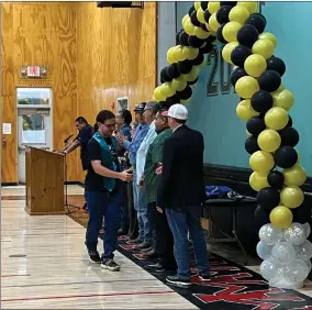  ?? RECORDER PHOTO BY ESTHER AVILA ?? Dakota Heggie, a recent graduate of Harmony Magnet Academy, shakes hands with the Tule River Tribal Council on Thursday when his name was called to be recognized during a Tule River tribal celebratio­n for the tribe’s 89 graduates.