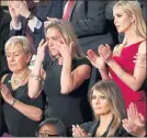  ??  ?? TEARS: From Carryn Owens, widow of Chief Special Warfare Operator William ‘Ryan’ Owens who was killed in Yemen last month, as she was acknowledg­ed by Mr Trump. First Lady Ivana Trump and daughter Ivanka look on.