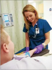  ?? PHOTO COURTESY ONEIDA HEALTHCARE ?? A registered nurse at Oneida Healthcare tends to a patient.