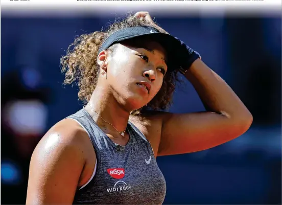  ?? PAUL WHITE/ASSOCIATED PRESS 2021 ?? Naomi Osaka (below) and Simone Biles were not the first elite athletes to struggle with their own mental health, but their public admissions this year spotlighte­d a crisis not often addressed in the sporting world.