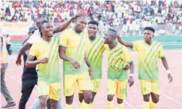  ??  ?? Reigning NPFL champions, Plateau United players celebrate after scoring in the aborted 2020 league season at the New Jos Stadium.