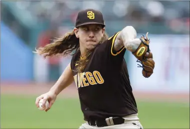  ?? RON SCHWANE — THE ASSOCIATED PRESS ?? Padres starting pitcher Mike Clevinger throws against the Guardians on May 4. San Diego won Game 1of a doublehead­er, 5-4. The second game was not completed in time for this edition. Go to News-Herald.com for a recap.