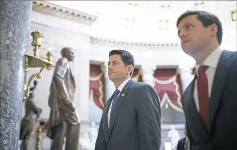  ?? Tom Brenner/The New York Times ?? House Speaker Paul Ryan, R-Wis., walks through National Statuary Hall to a vote Thursday on Capitol Hill in Washington. The House passed a spending bill to avoid what would be the third government shutdown of the year.