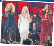  ??  ?? Karen Fairchild, Dolly Parton and Kimberly Schlapman performed at the Grammys at a tribute to the veteran country music singer