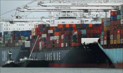  ?? BEN MARGOT — THE ASSOCIATED PRESS ?? The Yang Ming shipping line container ship Ym Utmost is unloaded at the Port of Oakland on Monday in Oakland, California. The Trump administra­tion on Friday will start imposing tariffs on $34 billion in Chinese imports.