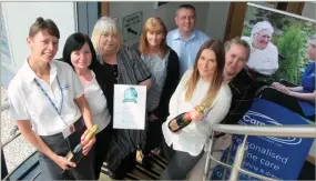  ??  ?? Award winners: Graham Livingston­e and his team at Caremark