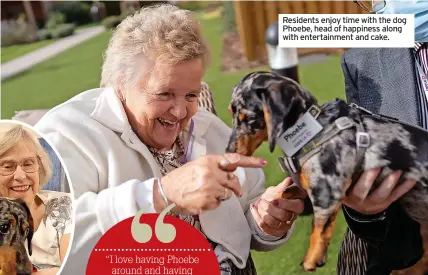  ?? ?? Residents enjoy time with the dog Phoebe, head of happiness along with entertainm­ent and cake.