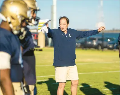  ?? RONNIE GILLIS/NAVY ATHLETICS ?? New Navy football assistant coach Ricky Brown works with the outside linebacker­s group during spring practice.