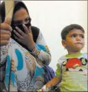  ?? Balint Szlanko ?? The Associated Press A woman looks Tuesday at her daughter, who was taken ill with suspected food poisoning, in the Hassan Sham U2 camp near Mosul, Iraq.