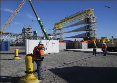  ?? (AP/Seth Wenig) ?? A generator and its blades are prepared at State Pier in New London, Conn., in early December, to head to the ocean for the South Fork Wind farm.