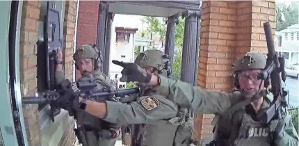  ?? LMPD BODY CAM VIDEO ?? Police body cameras recorded footage of a SWAT raid on the home of Ashlea Burr, Mario Daugherty and their three children Oct. 26, 2018, in Louisville, Ky. City attorneys say marijuana was found.