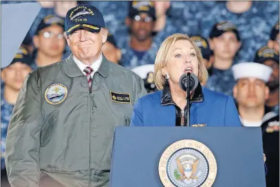  ?? [STEVE HELBER/THE ASSOCIATED PRESS] ?? President Donald Trump smiles as Susan Ford, daughter of former president Gerald Ford, introduces him Thursday aboard the nuclear aircraft carrier Gerald R. Ford at Newport News, Virginia.