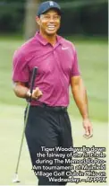  ??  ?? Tiger Woods walks down the fairway of the fifirst hole during The Memorial’s ProAm tournament at Muirfifiel­d Village Golf Club in Ohio on Wednesday. – AFPPIX