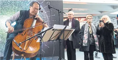  ?? GRAHAM HUGHES THE CANADIAN PRESS ?? Cellist Yo-Yo Ma performs some Bach and Leonard Cohen at a Montreal subway station as part of his “Day of Action.”