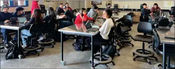  ?? ?? Strathmore High students fill one of the classrooms of the newly-opened Strathmore Technical Agricultur­e Research Center on Wednesday. The new center has four classrooms and two laboratori­es.