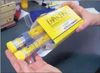  ?? RICH PEDRONCELL­I/ASSOCIATED PRESS ?? Price hikes for EpiPens, an epinephrin­e autoinject­or for treating allergic reactions, have made its maker, Mylan, the target of patients and politician­s infuriated by soaring drug prices.